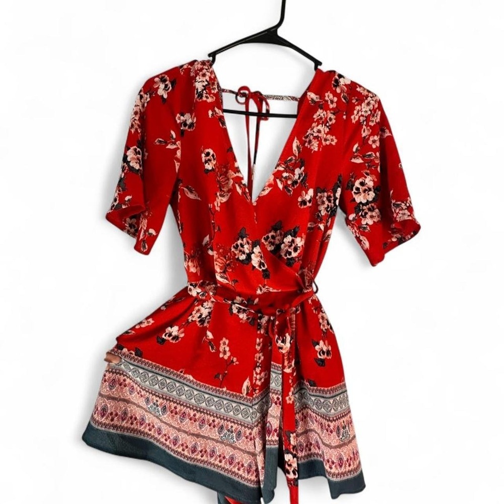 Trixxi Red Floral Romper With A Tied Waist and V-Neckline.‎